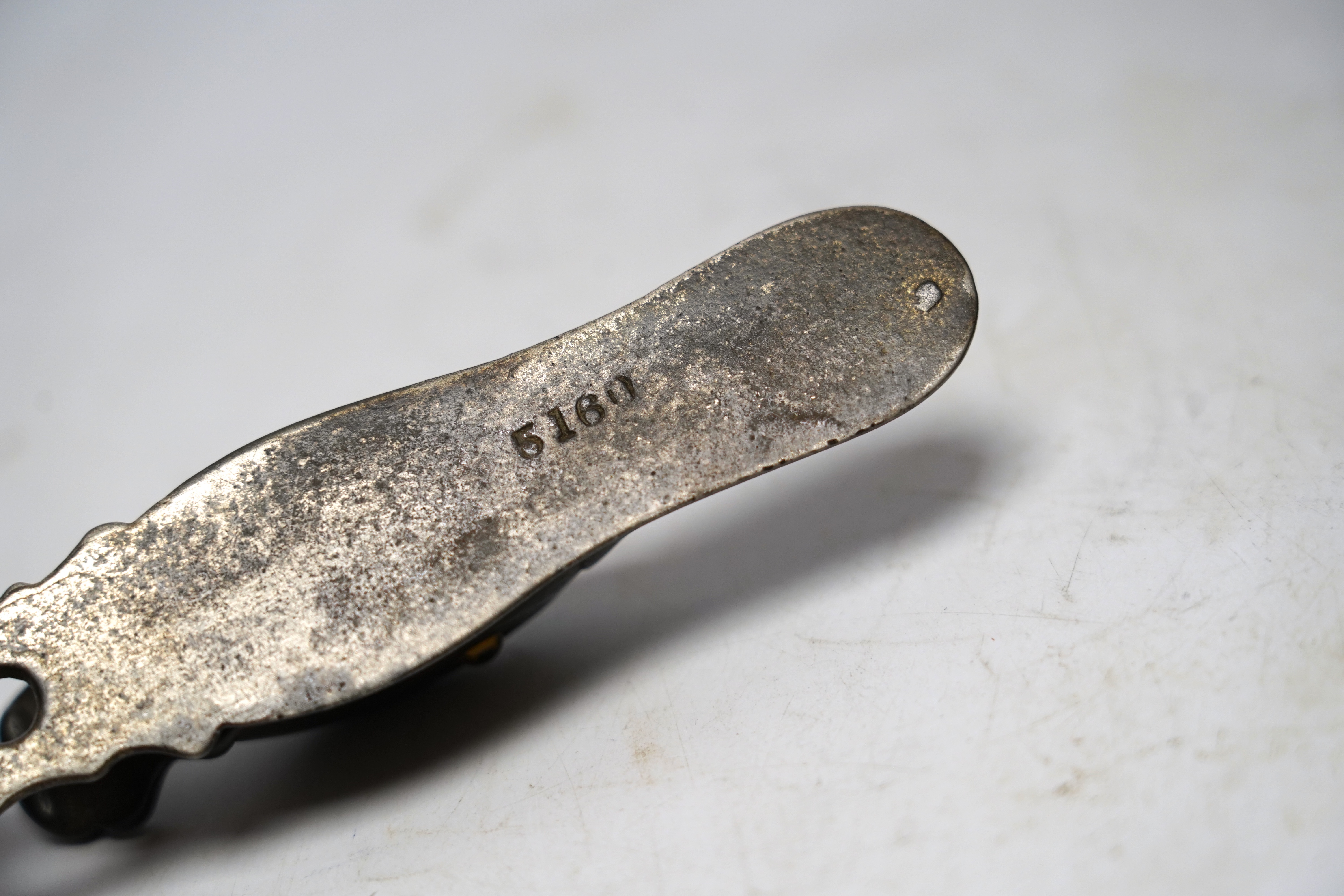 A base metal, glass eyed duck’s head letter clip, with stamp on base: 5180, 13cm long